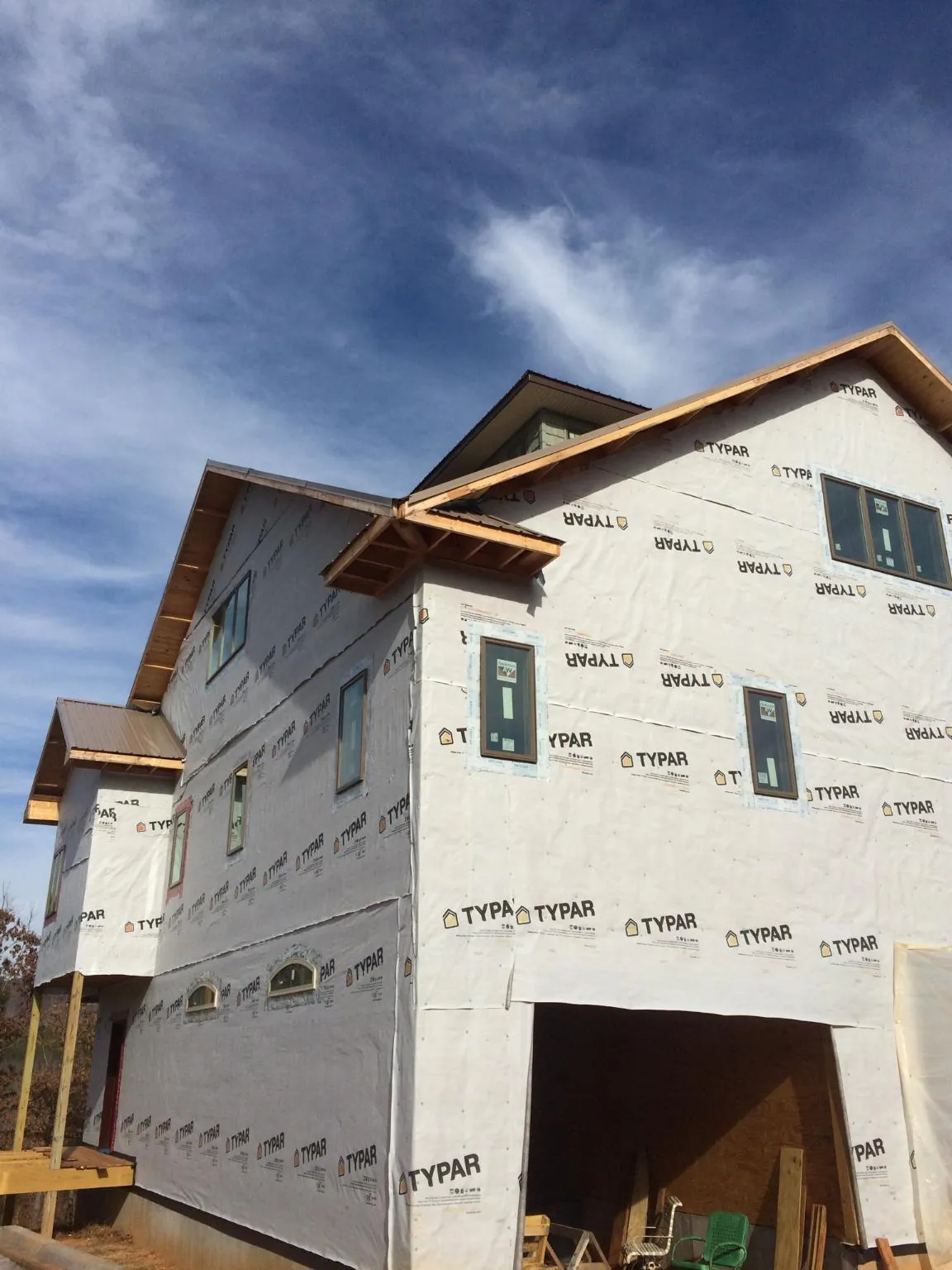 Stick built house wrapped in Typar with new roof framing and dormers in Vancleave